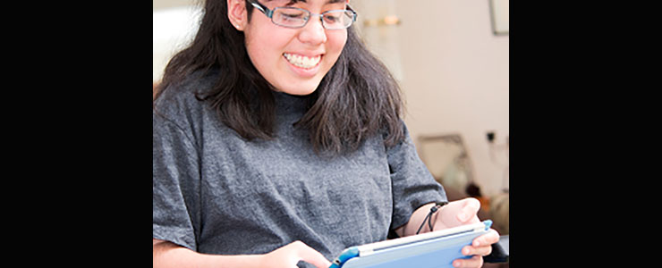 young adult woman using a handheld device