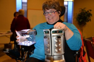 Woman displays two portable emergency lights.