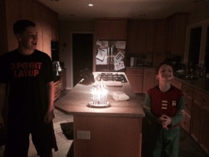 Nate and his brother with Chanukah candles