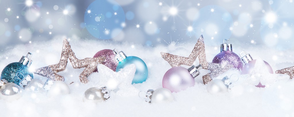 holiday background with blue baubles, snow and snowflakes,