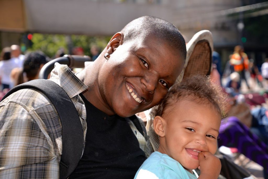 Mother and toddler smiling