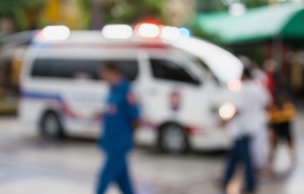 Ambulance responding to an emergency call blurred background