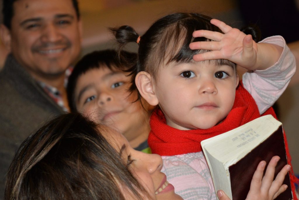 close up of family faces at a group gathering