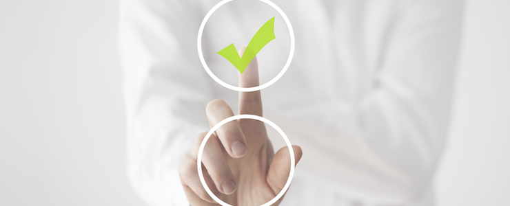 Woman in white, set against white background, touching button in foreground and ticking lime green check box.