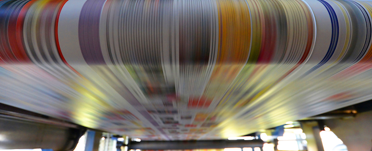 printing of colored newspapers with an offset printing machine at a printing press