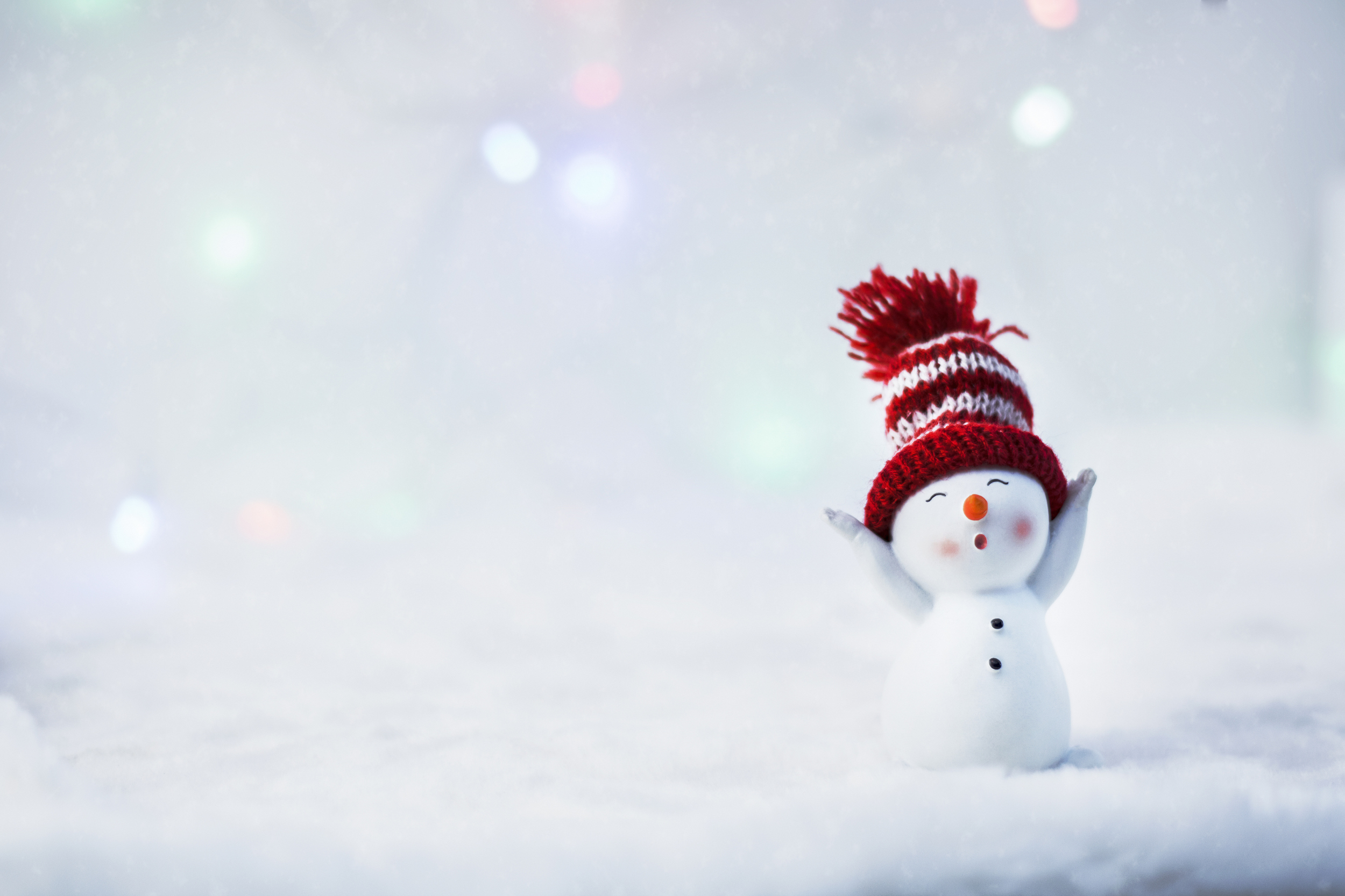 Happy snowman standing in winter christmas landscape. Merry christmas and happy new year greeting card. Funny snowman in hat on snowy background. Copy space for text (Happy snowman standing in winter christmas landscape.