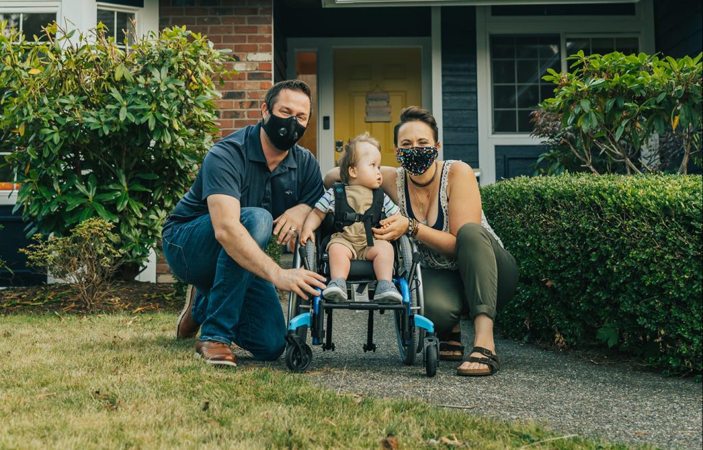 Stohr family outside, smiling, wearing masks.